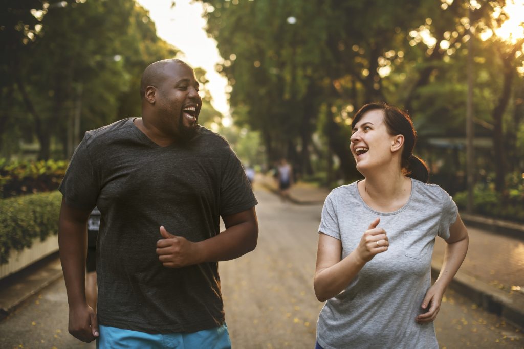 couple exercising together in park